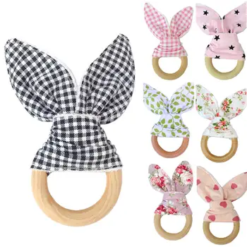 

Wooden Newborn Baby Bunny Ear Teething Floral Ring Safety Chew Teether Gift These teething toys are gentle on gums