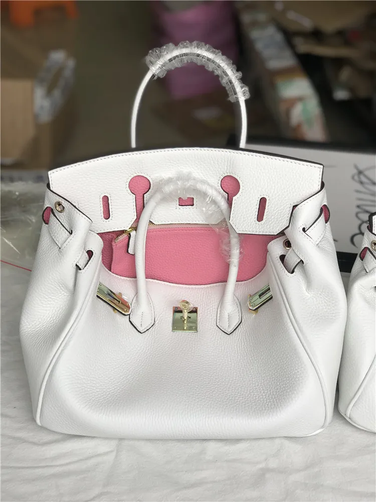 

2020 Baotou Layer Cowhide Contrast Color Matching White Spell Powder Litchi Grain Genuine Leather Woman Package