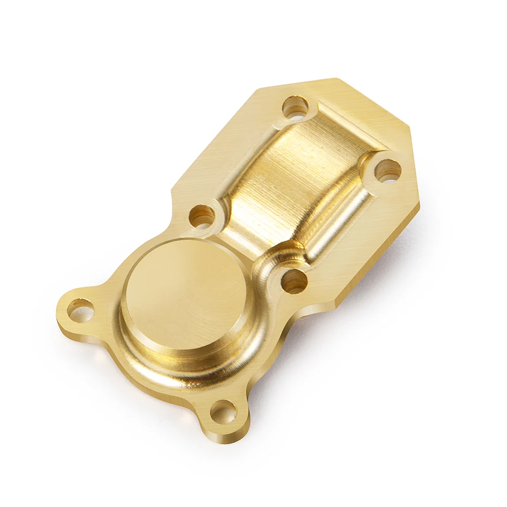 Pièce de rechange RC : couvercle de différentiel en laiton AXSPEED pour SCX24, sur fond blanc.
