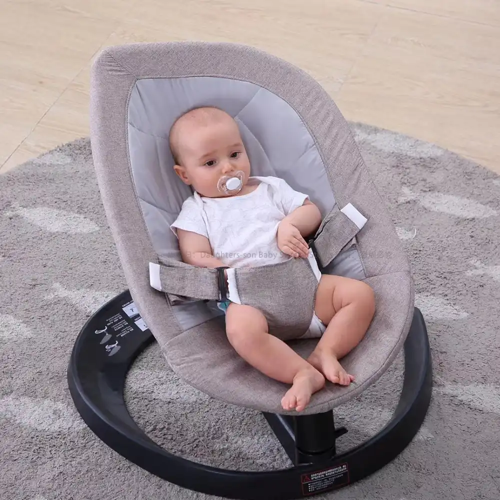 infant sleeping in bouncer