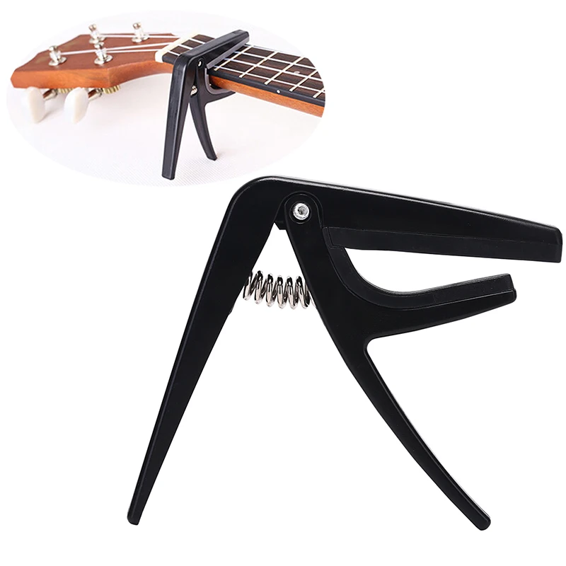 

1PCS Black Color Ukulele Capo Single-handed Quick Change Ukelele Capo Plastic Steel Guitar Parts & Accessories