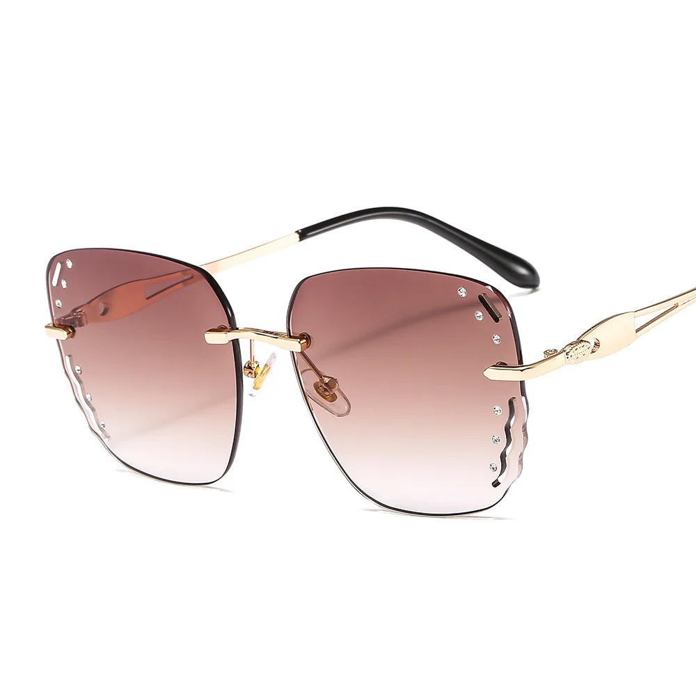 

New Personality Trends Frameless Wavy Frame Sunglasses Women Diamond Female Glasses