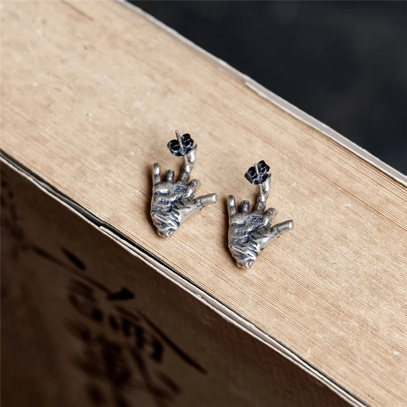 Main squelettique boucles d'oreilles