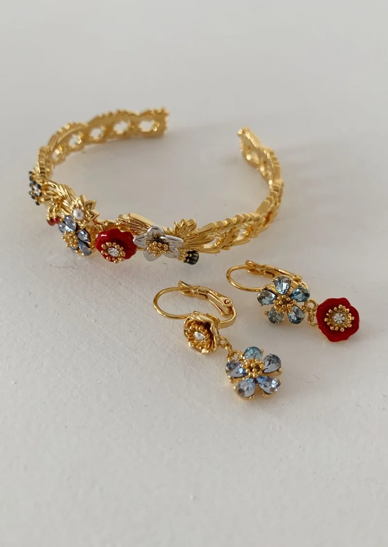 

Custom French bracelet with multiple gem and flowers