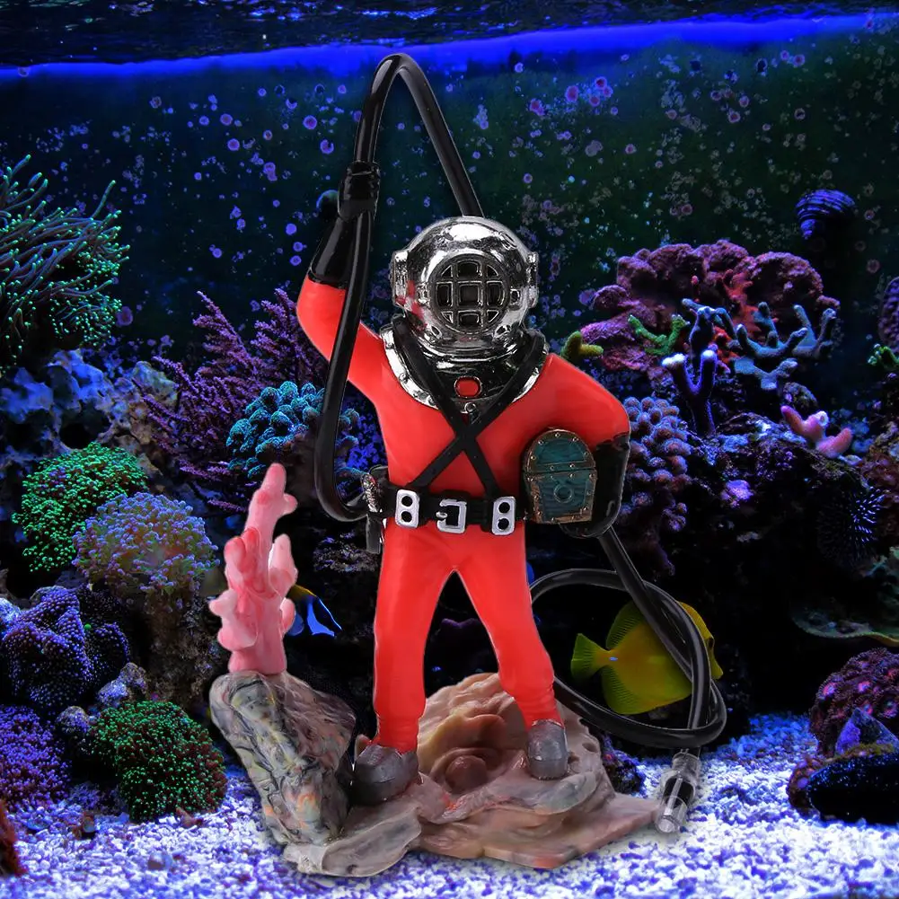 diver moving aquarium decorations