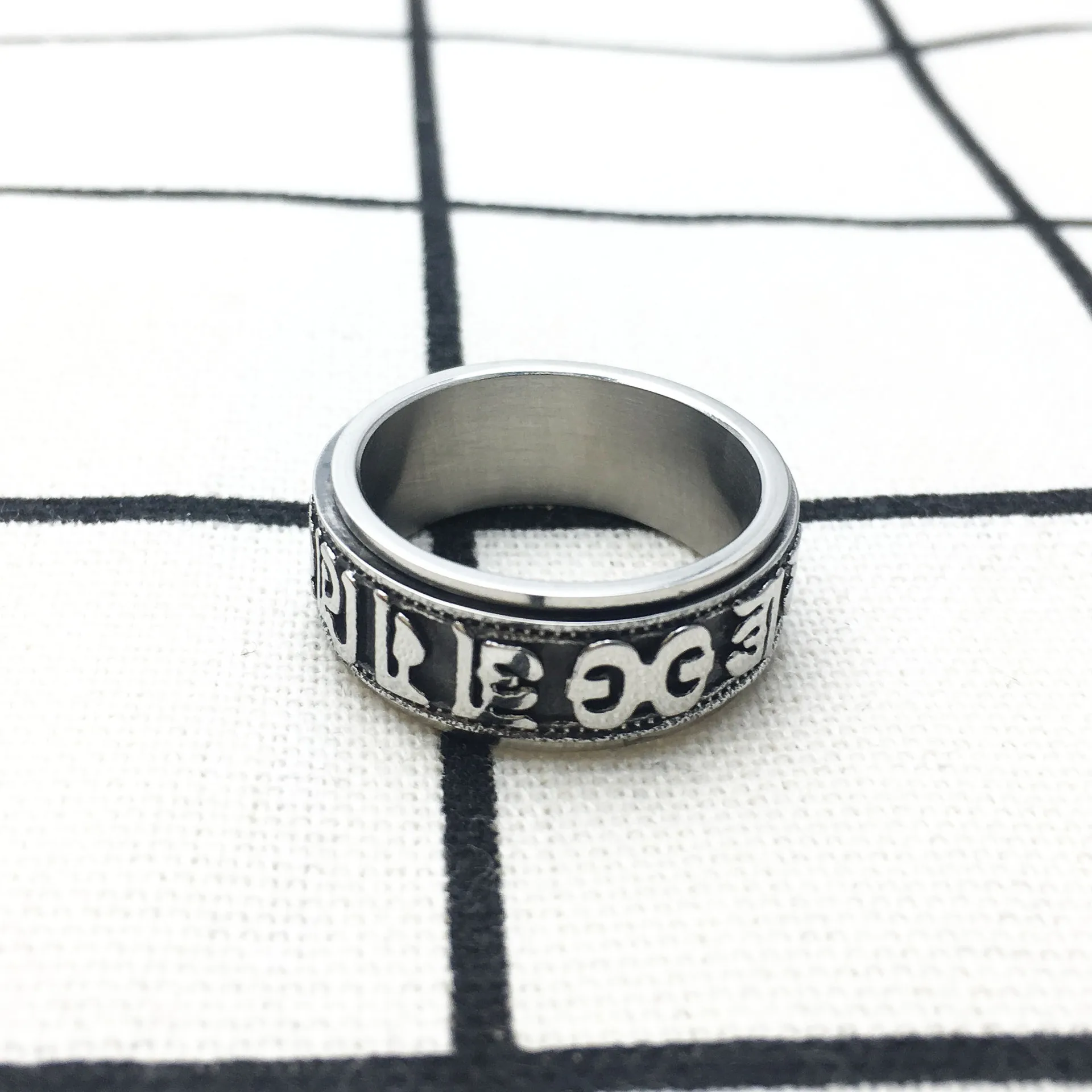 Megin D Stainless Steel Titanium Spinning Rotatable Word of Truth Vintage Boho Retro Hip Hop Rings for Men Women Couple Jewelry