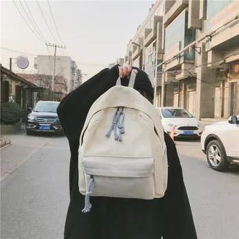 

Large capacity schoolbag female high school student backpack Korean retro simple girl campus style solid color rucksack