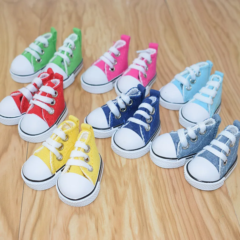 1 par 5CM zapatos de lona zapatos de muñeca vestido de zapatos casuales zapatos de Muppet zapatos para muñeca de juguete Mini zapatillas con simulación colgante llavero de zapatos