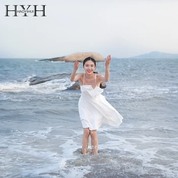 

HYH Haoyihui 2020 New Fashion Holiday Style Backless Asymmetry White Strap Sweet Women Mid Dress