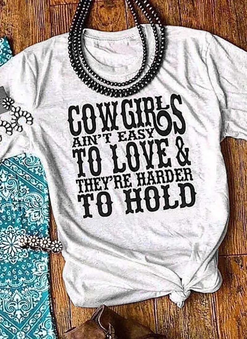 

Cowgirls ain't easy to love They're harder to hold Printed New Arrival Women's Summer Funny Casual 100%Cotton T-Shirt