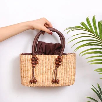 

2020 new rattan female handbag travel leisure small woven bag beaded decorative tassel straw bag