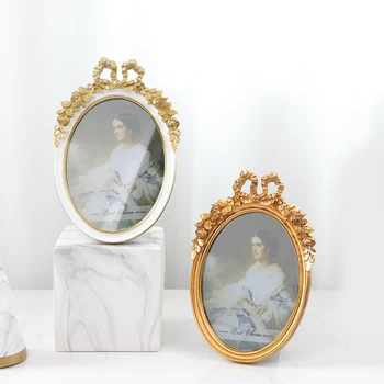 

French Relief Resin 7 Inch Photo Frame Golden Bow Photo Frame Modern Home Decoration Living Room Bedroom Palace Style Decoration