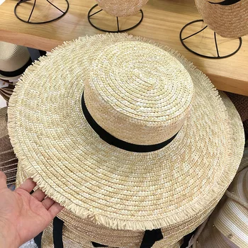 

202005-hexin ins design handmade straw wind Tassels brim leisure lady holiday beach sun cap women outdoor hat