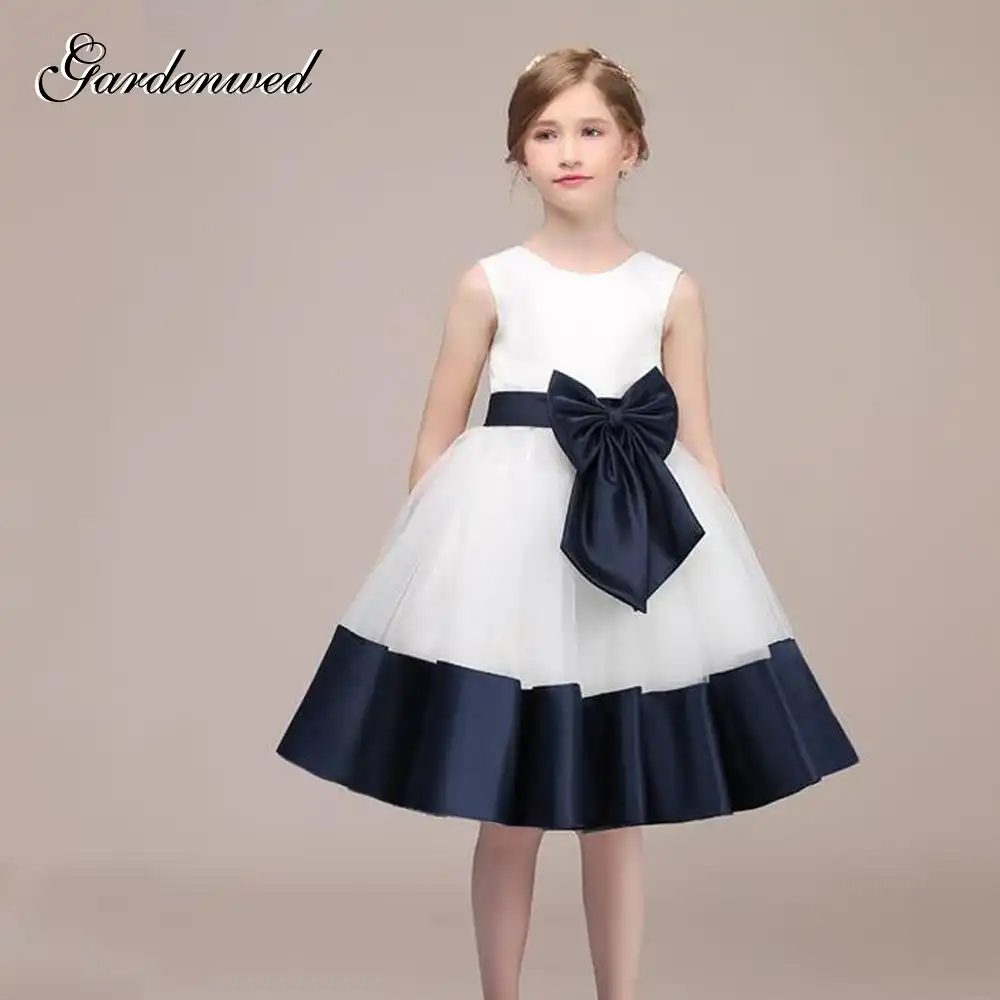 white flower girl dress with blue sash