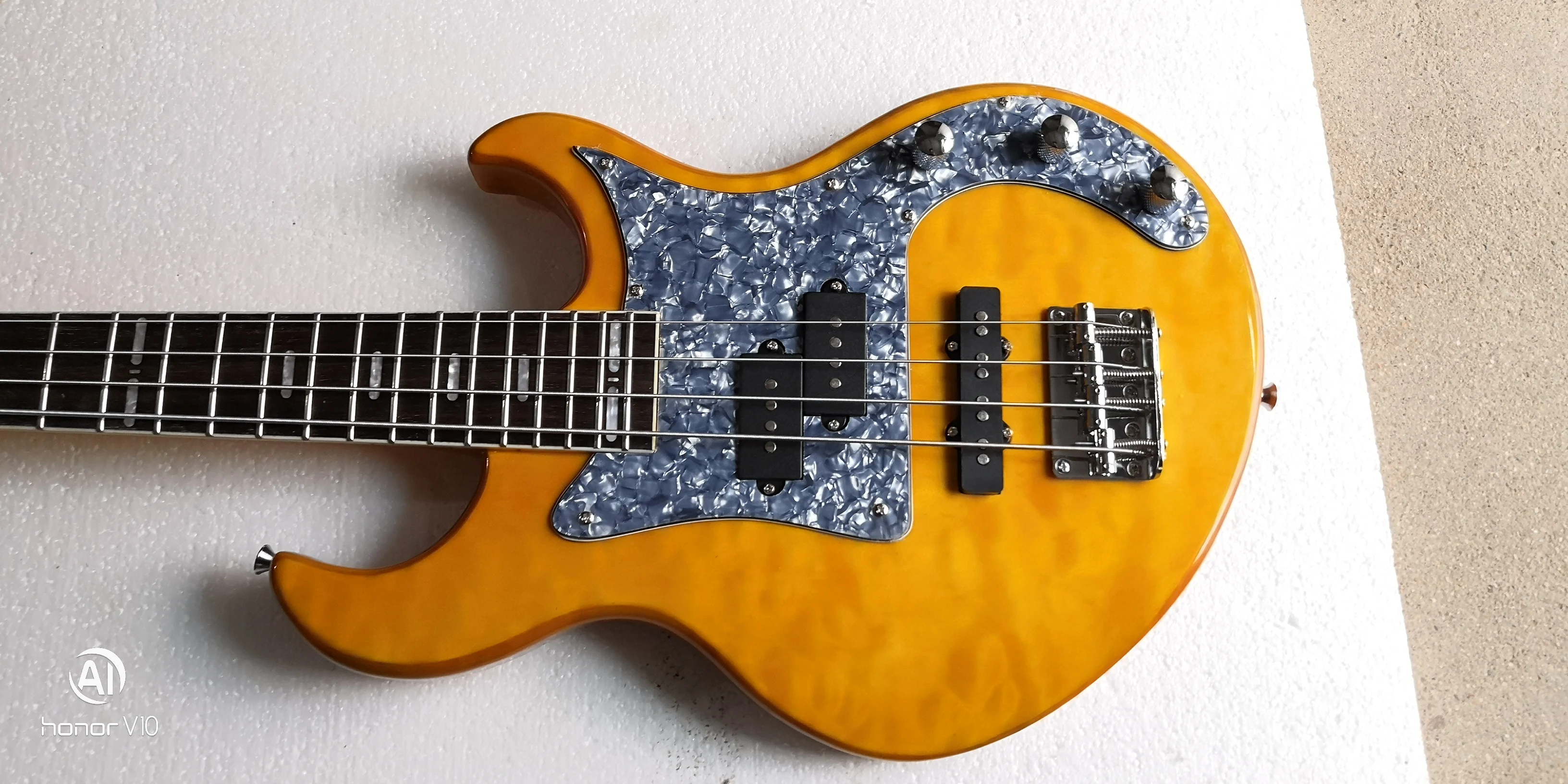 

Yellow color with quilted maple veneer pj electric bass