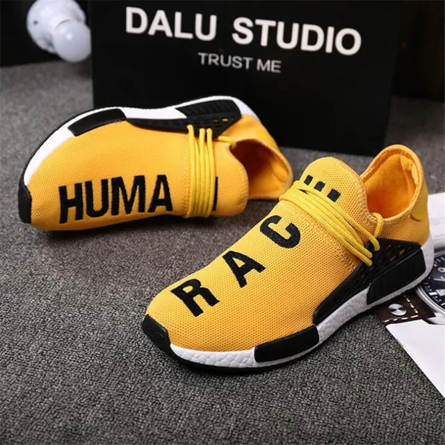 yellow human race trainers