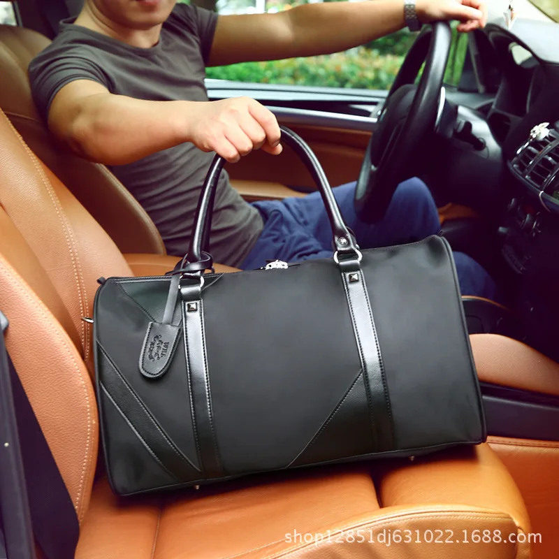 

Male Waterproof Oxford Large Capacity Mobile Travel Bag Business Travel Light and Short Travel Package Fashion Shoulder Luggage
