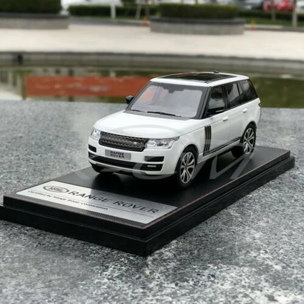 Модель автомобиля ЖК Модели Range Rover 1:43(белый)+ маленький подарок