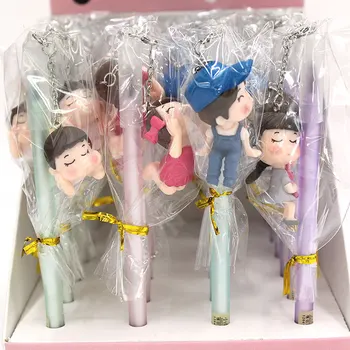 

24 pcs/lot Creative Boy Girl Doll Pendant Gel Pen Cute Black ink Signature Pens Promotional Gift Stationery School Supplies