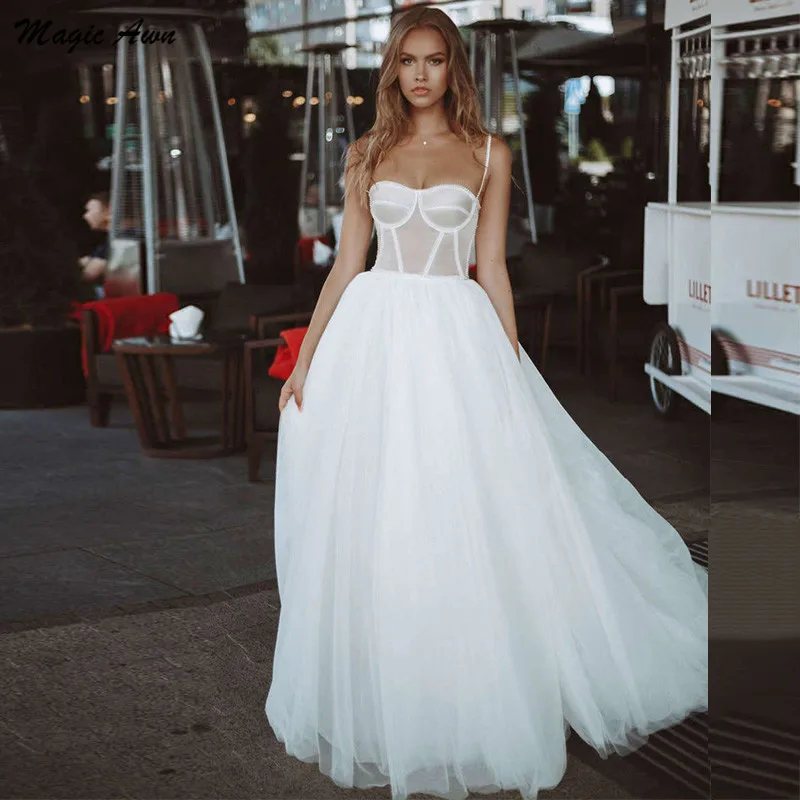 

Magic Awn 2021 Boho Wedding Dresses Illusion Pearls Beaded Spaghetti Straps Beach A-Line Tulle Bridal Gowns Vestidos De Fiesta
