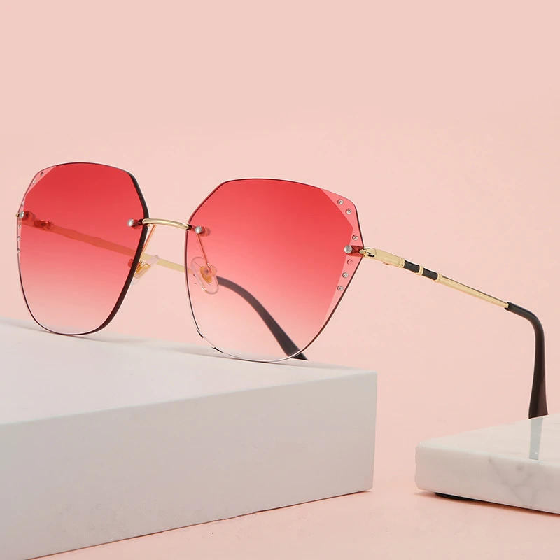 Новые безрамные солнцезащитные очки для женщин с отделкой инкрустированные