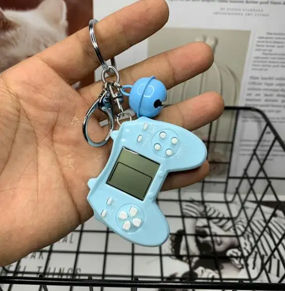Retro Console Game Keychain Built-In 7 Games Puzzle Video Game Mini Handheld Game Console Pendant New Year Xmas Gift For Kids 