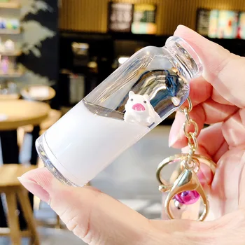 

Floating Creative cute pig acrylic milk bottle Keychain Moving Liquid quicksand drift bottle keyring for women bag pendant K076