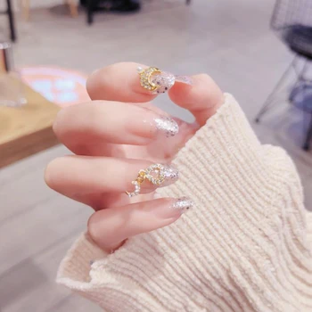 

24pcs/boxed pre decorated fake press on nails with designed with Faux Pearl and Drills Glitter Middle Long artificial nail tips