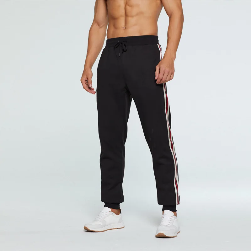 

2019 Autumn and Winter New Casual Sports Pants Men's Color Vertical Strip Loose Tie Trousers Men's Loose Waist Beam Trousers