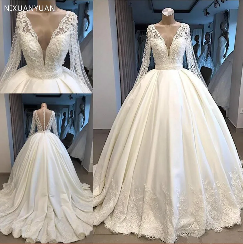 Wedding Dress with Beading Crystals Long Sleeves Illusion Back Covered with Buttons V Neck Dubai Arabic Bridal Gowns