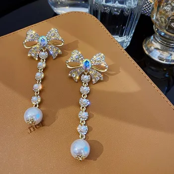 

New atmosphere Hyperbole style fine crystal bowknot Women earrings contracted long shiny sweet pearl trend Drop earrings senior