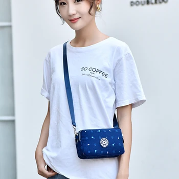 

2020 New mobile phone bag female messenger mini small bag cross section Korean wild canvas clutch bag wrist coin purse