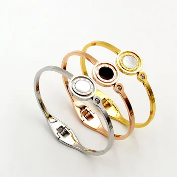 

Fashion rotating black and white double-sided Roman numeral spring open bracelet female bracelet