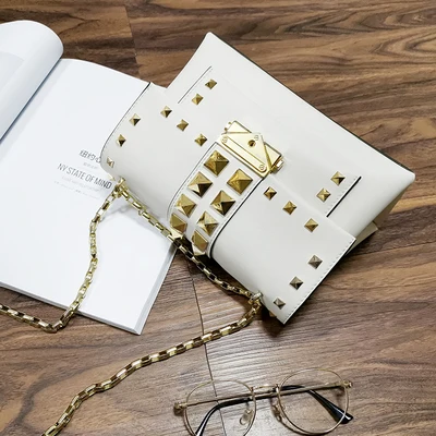 

Studded leather ladies messenger shoulder bag