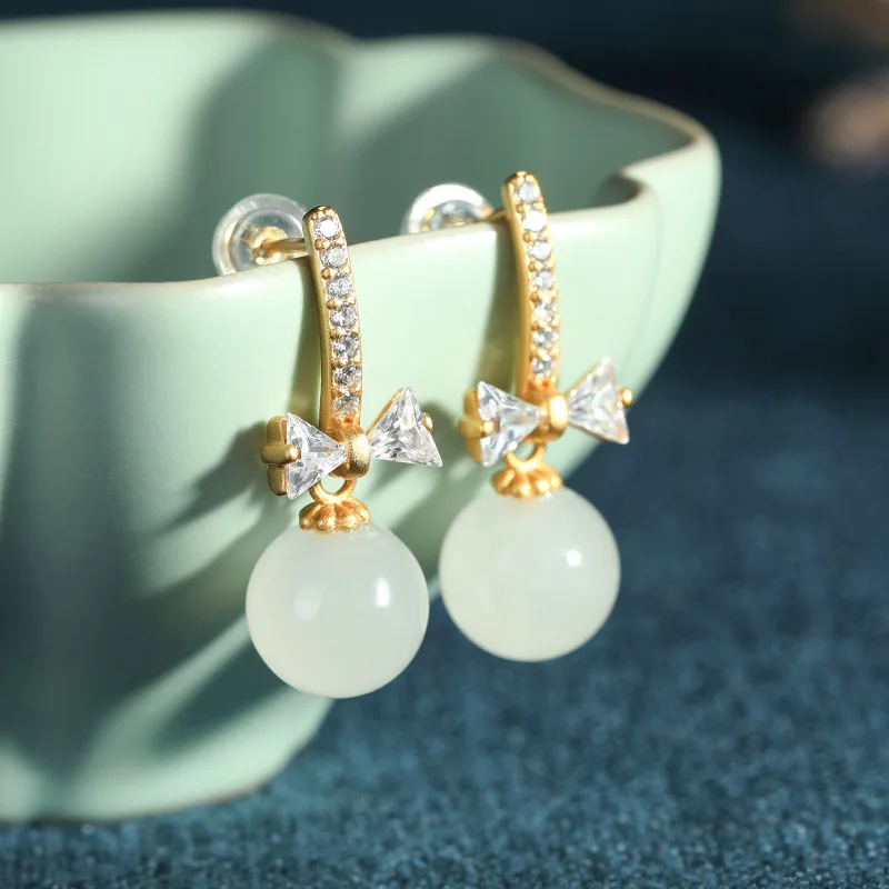 

S925 sterling silver inlay and Tianyu white jade bow beads cute small fresh earrings