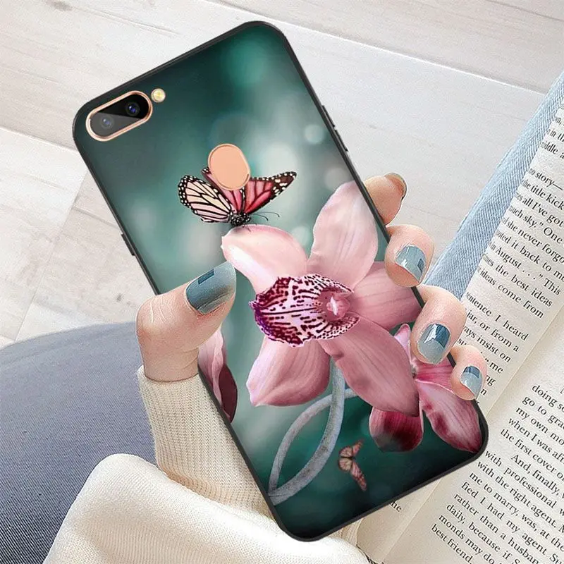 Red butterfly on white roses flower