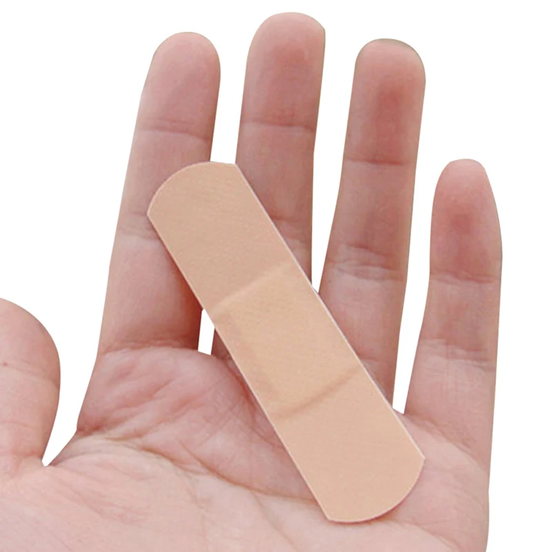 Vendaje de primeros auxilios para heridas, cojín adhesivo impermeable y transpirable para hemostasia, 100 unids/lote