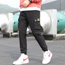Брюки для бега в стиле хип-хоп, мужские черные спортивные штаны, штаны-шаровары с несколькими карманами и лентами, мужские повседневные уличные брюки-карандаш, брюки-карго