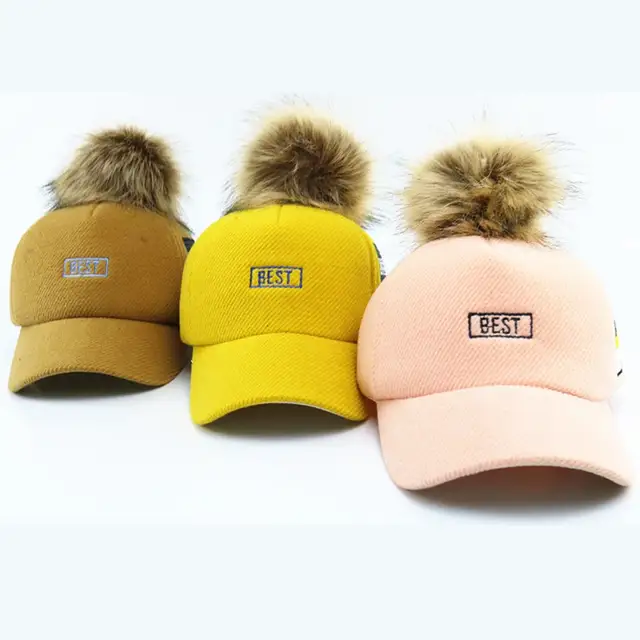 baseball hat with ball on top