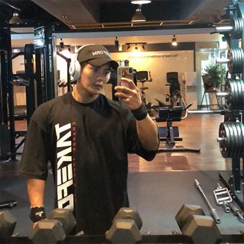 

Summer sport t shirts Men fitness loose tops big size elastic Bodybuilding short sleeve Running training trendy Street tee tops