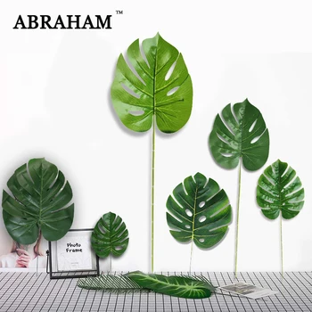 

Real Touch Fake Palm Tree Leafs Plastic Artificial Plant Tropical Leaves Big Monstera Green Turtle leaf For Hawaii Party Decor