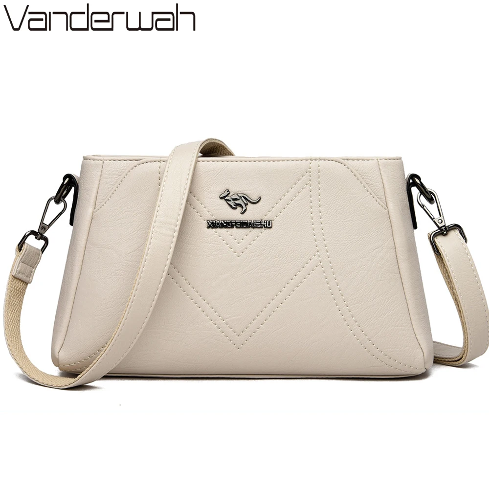 beige designer handbolsa