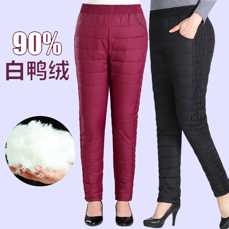 Повседневные женские брюки на белом утином пуху зимние толстые теплые узкие