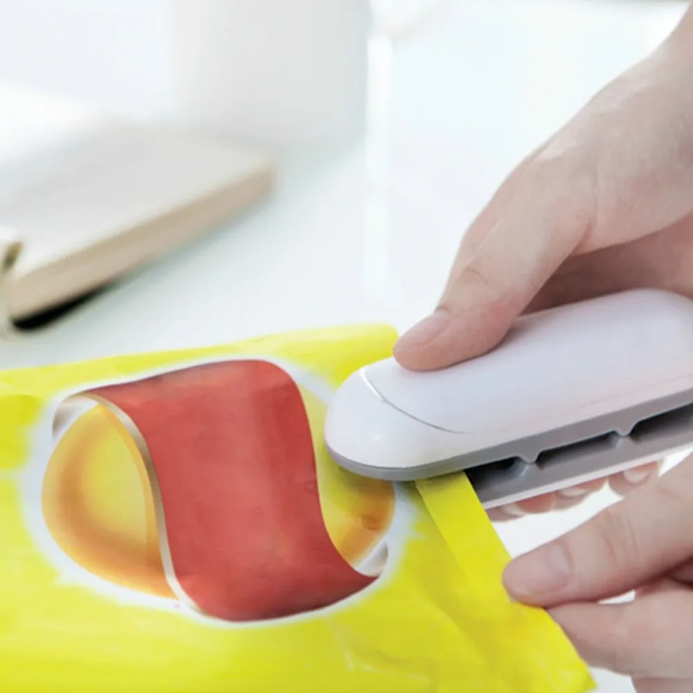 

Fashion Food Sealer Machine Hand Pressure Convenient Mini Snack Plastic Bag Vacuum Food Heat Sealing and Packaging Machine