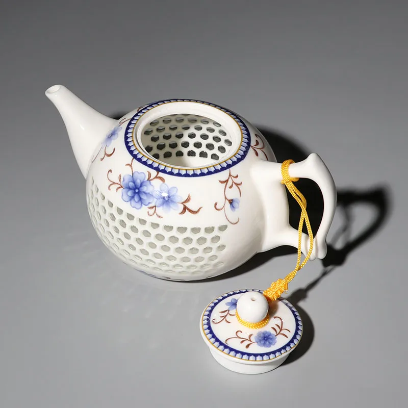 

Ceramic Blue and White Porcelain Kung Fu Tea Set Linglong Tea Set Crystal Hollow Teapot Jingdezhen