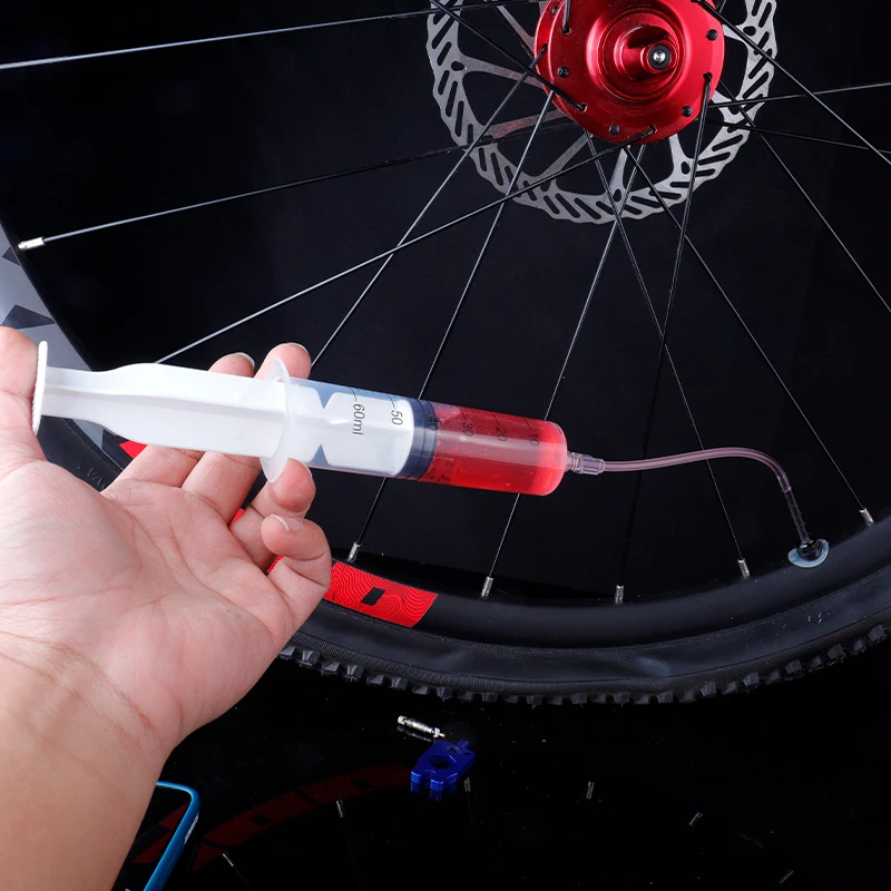 Kit de seringue de vélo sans chambre à air, seringue de mastic de pneu sans  chambre à air de vélo avec interrupteur, outils de cyclisme portables  Bavokon : : Sports et Plein