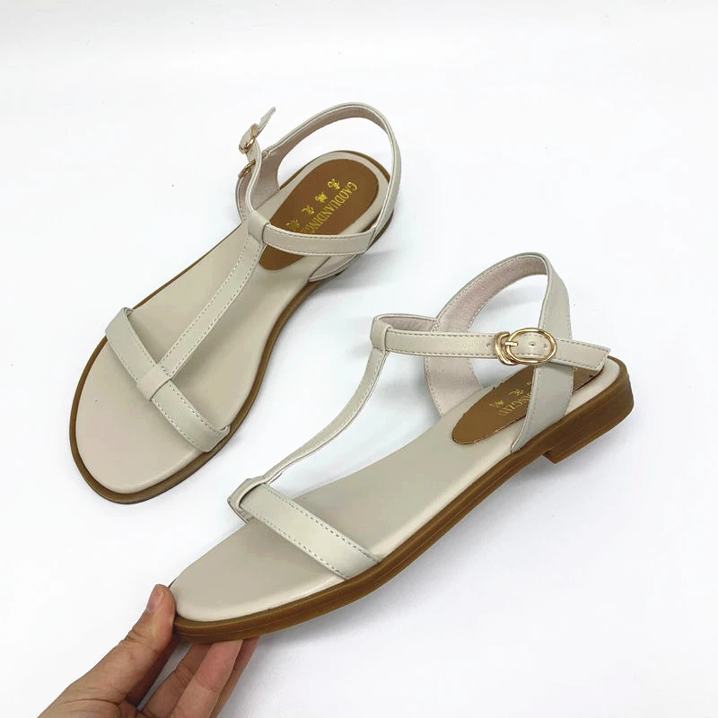 white and gold flat sandals