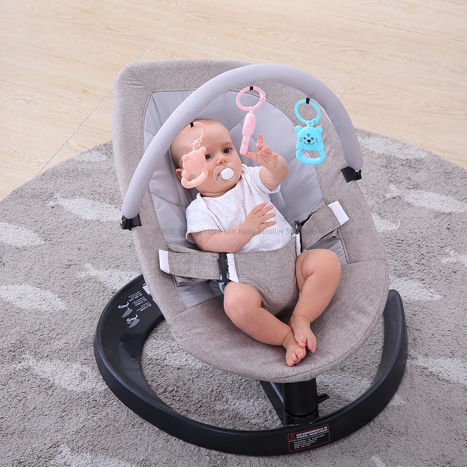 newborn sleeping in bouncer