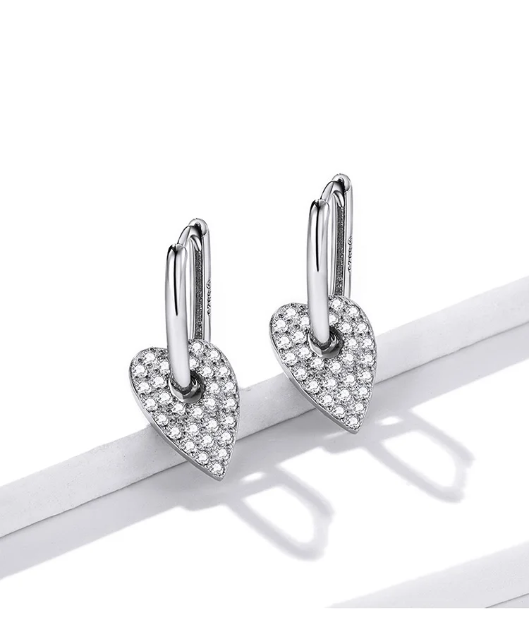 Heart Rectangle Hoop Earrings | S925 Sterling Silver | Go Glam Girl 10 Heart Rectangle Hoop Earrings | S925 Sterling Silver | Go Glam Girl - Show your style with the delicate Heart Rectangle Hoop Earrings. Hand-finished in sterling silver, every hoop earring has a heart dangling on it and encrusted with small sparkling zircons. These dreamy earrings, full of a romantic atmosphere will bring mood and beauty to your day. Perfect gift for mom, sister, grandmother, friend or yourself. | 🚚 Free Standard Shipping 7-30 days | 🥇 Top Quality Product | 💎 100% S925 Sterling Silver | 🛡️ 100% Safe & Secure checkout