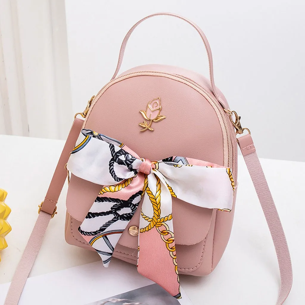 small pink backpack purse